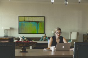 women_working_at_desk_laptop_coffee