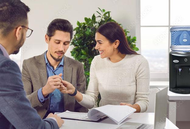 Woman signing an Eden Springs contract